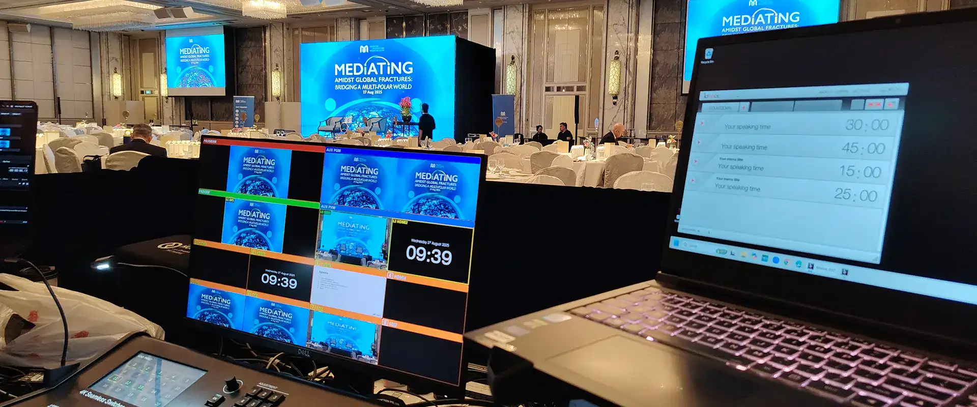 Event conference setup with screens and laptops for professional presentations by The Project Crew